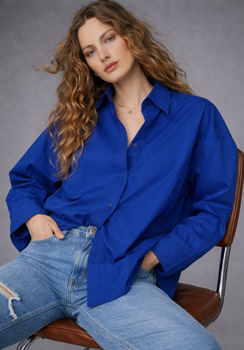 Side view of royal blue cotton poplin shirt