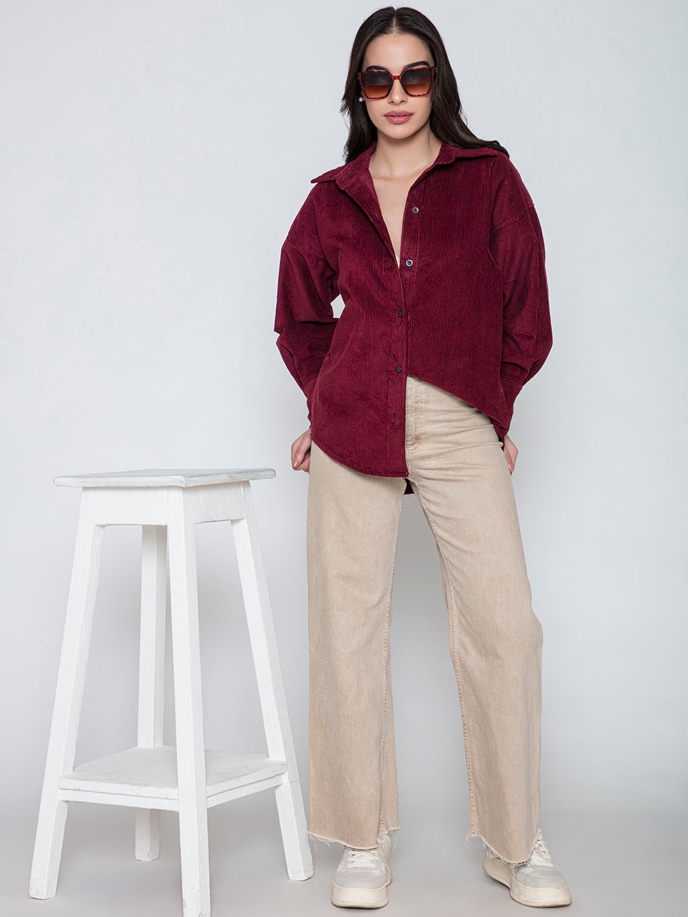 Side angle of maroon corduroy oversized shirt with spread collar