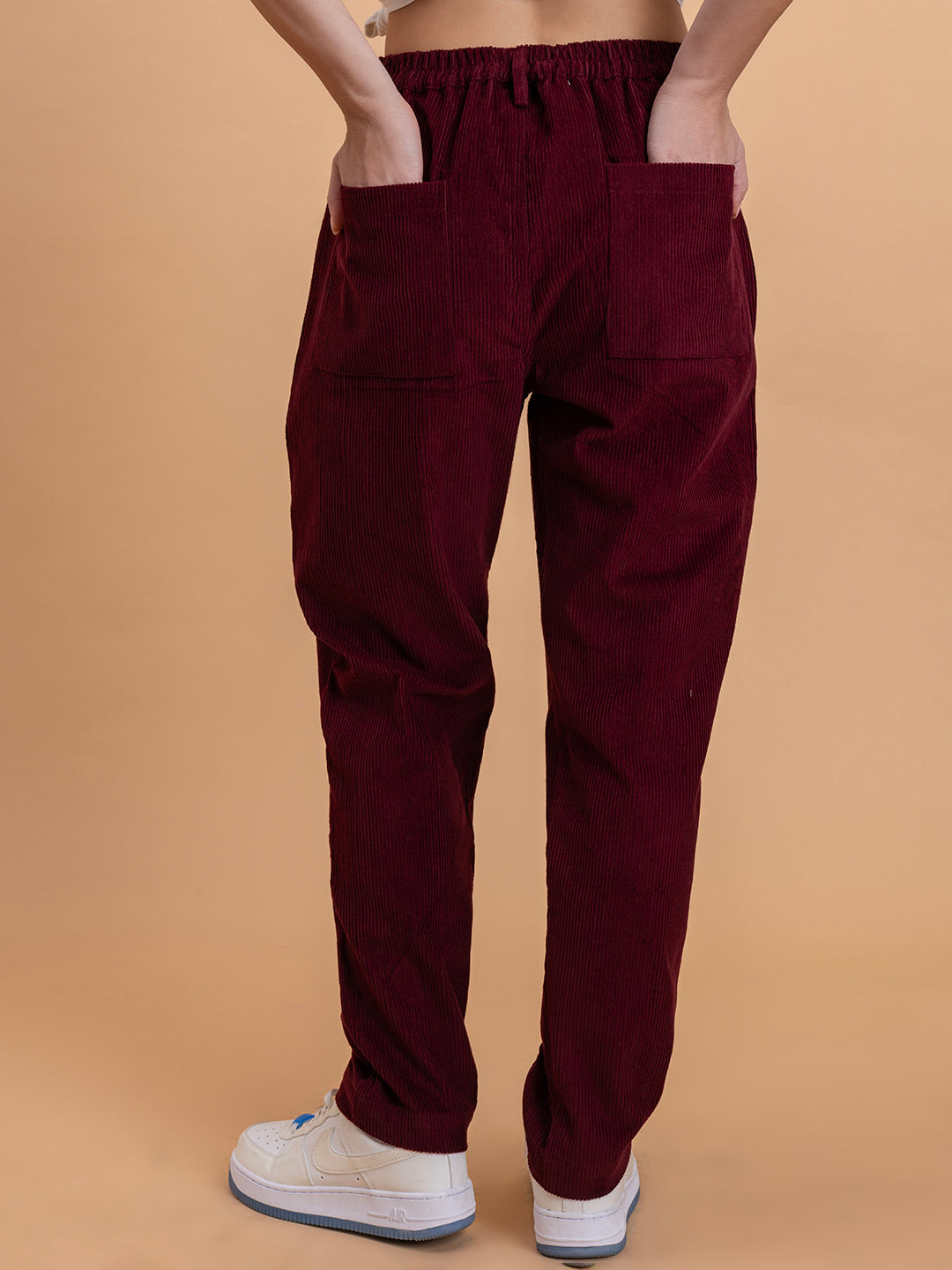 Back view of maroon corduroy baggy trousers