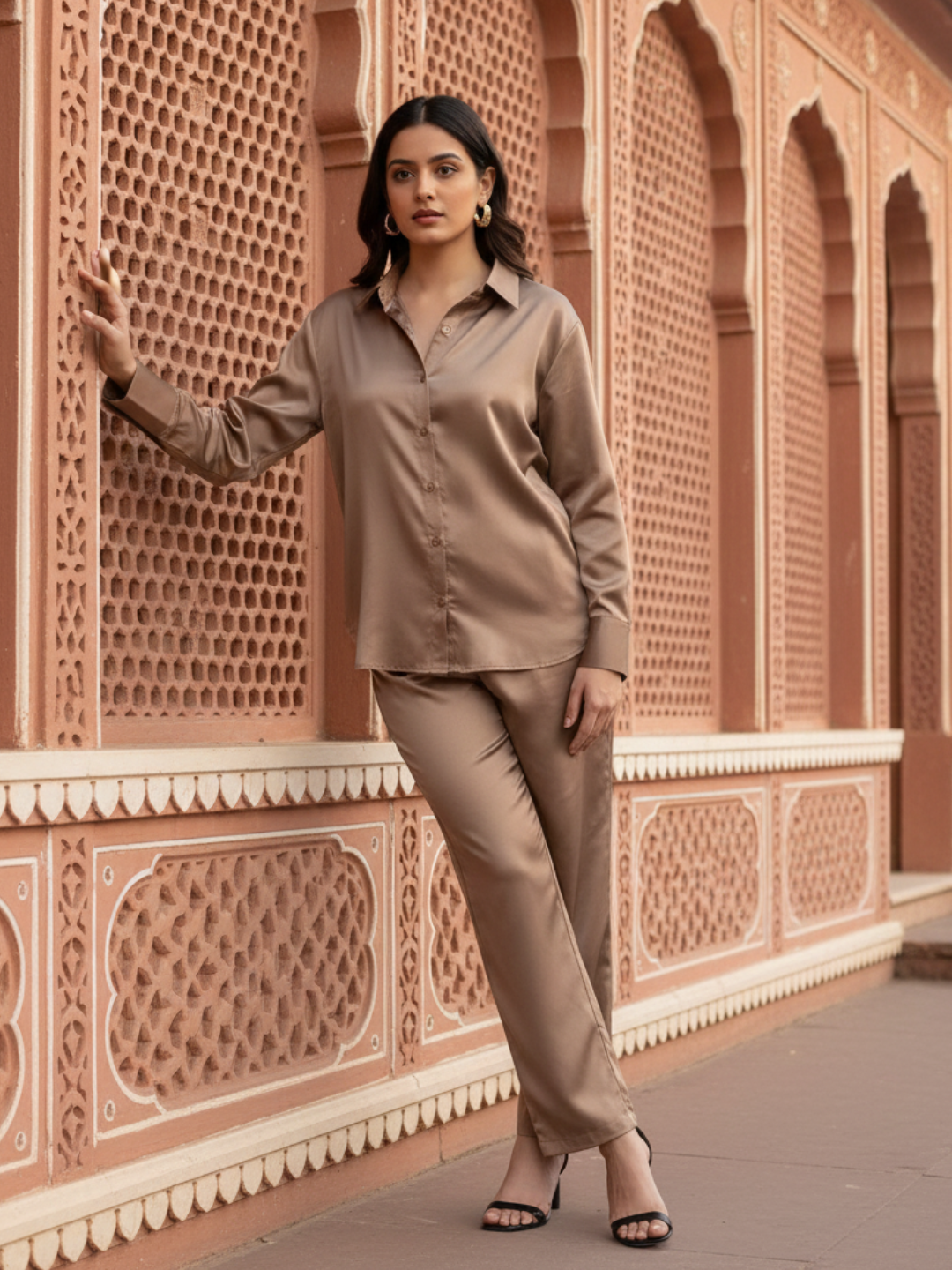 Model wearing beige satin co-ord set with relaxed fit shirt and pants