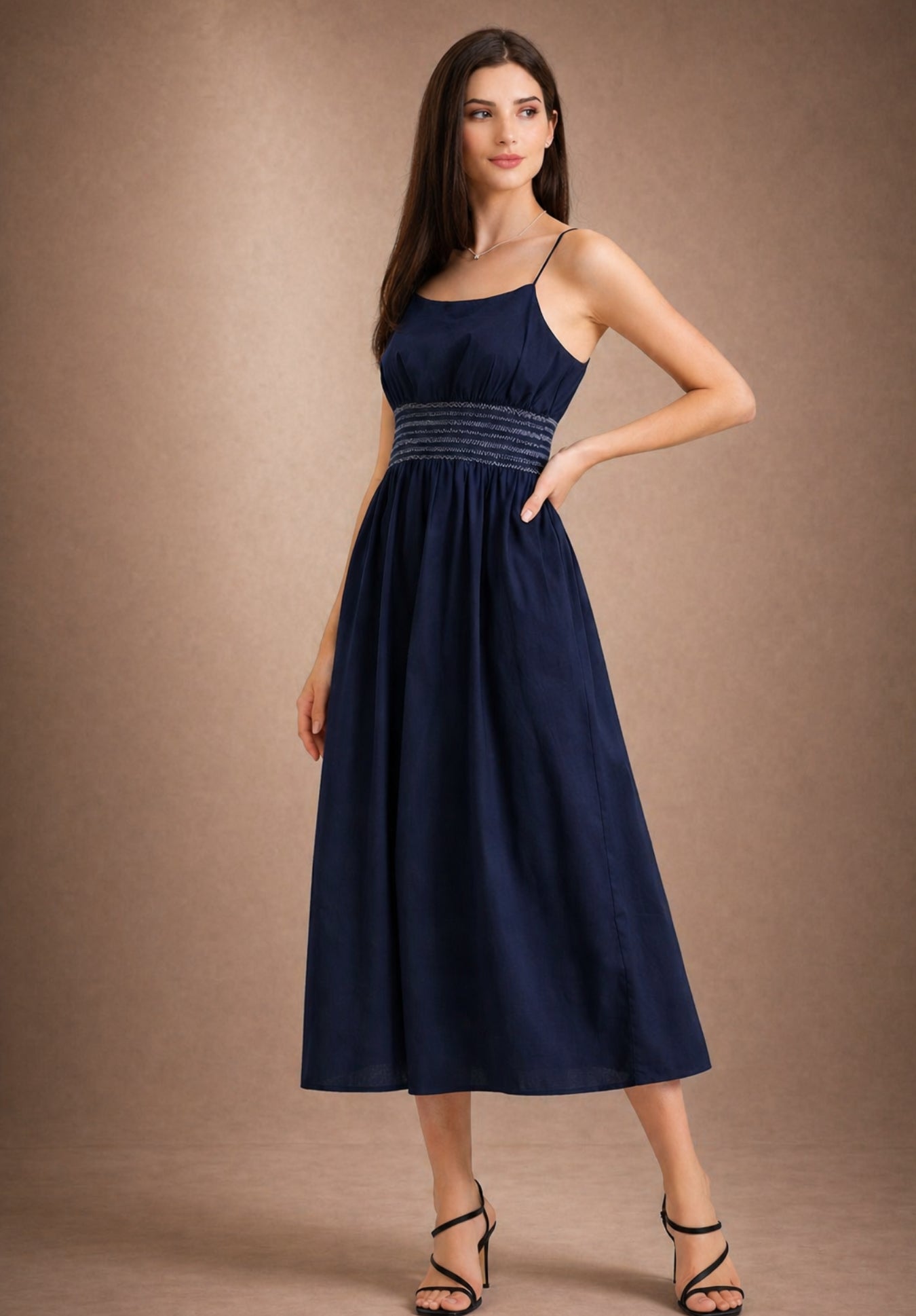 Lifestyle shot of navy embroidery dress styled with accessories