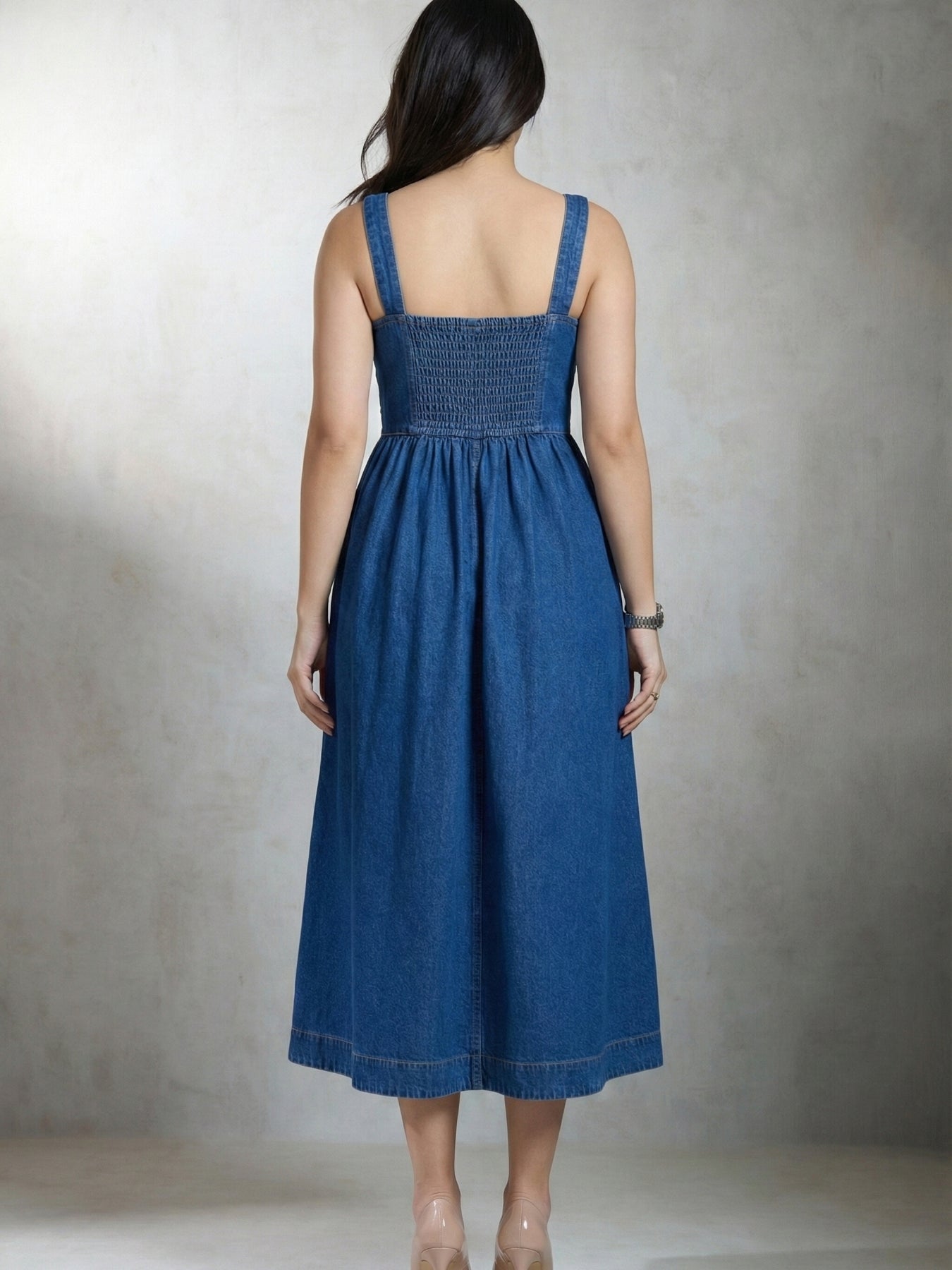 Back view of blue denim flared midi dress