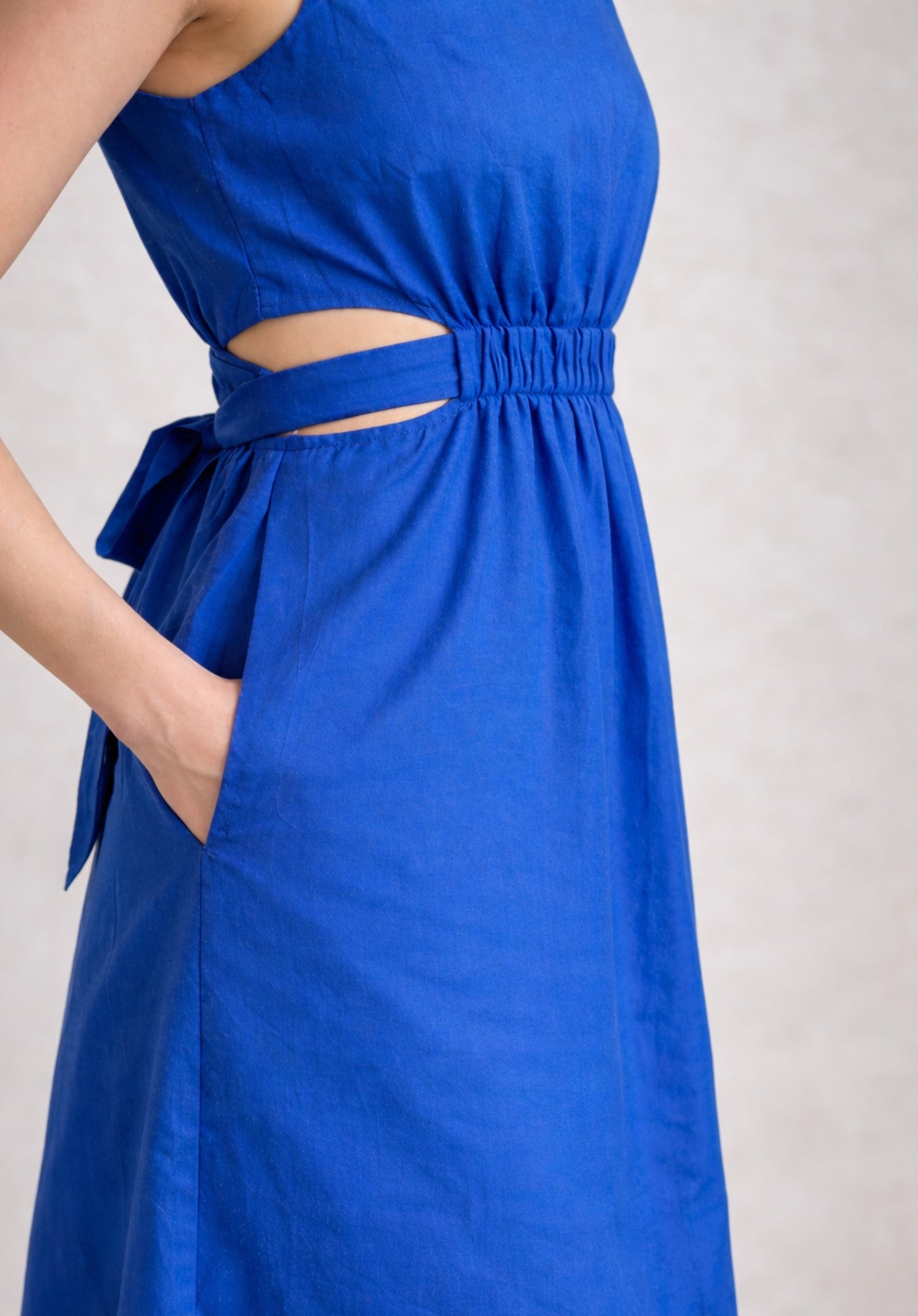 Detail of button-down front on blue cotton dress