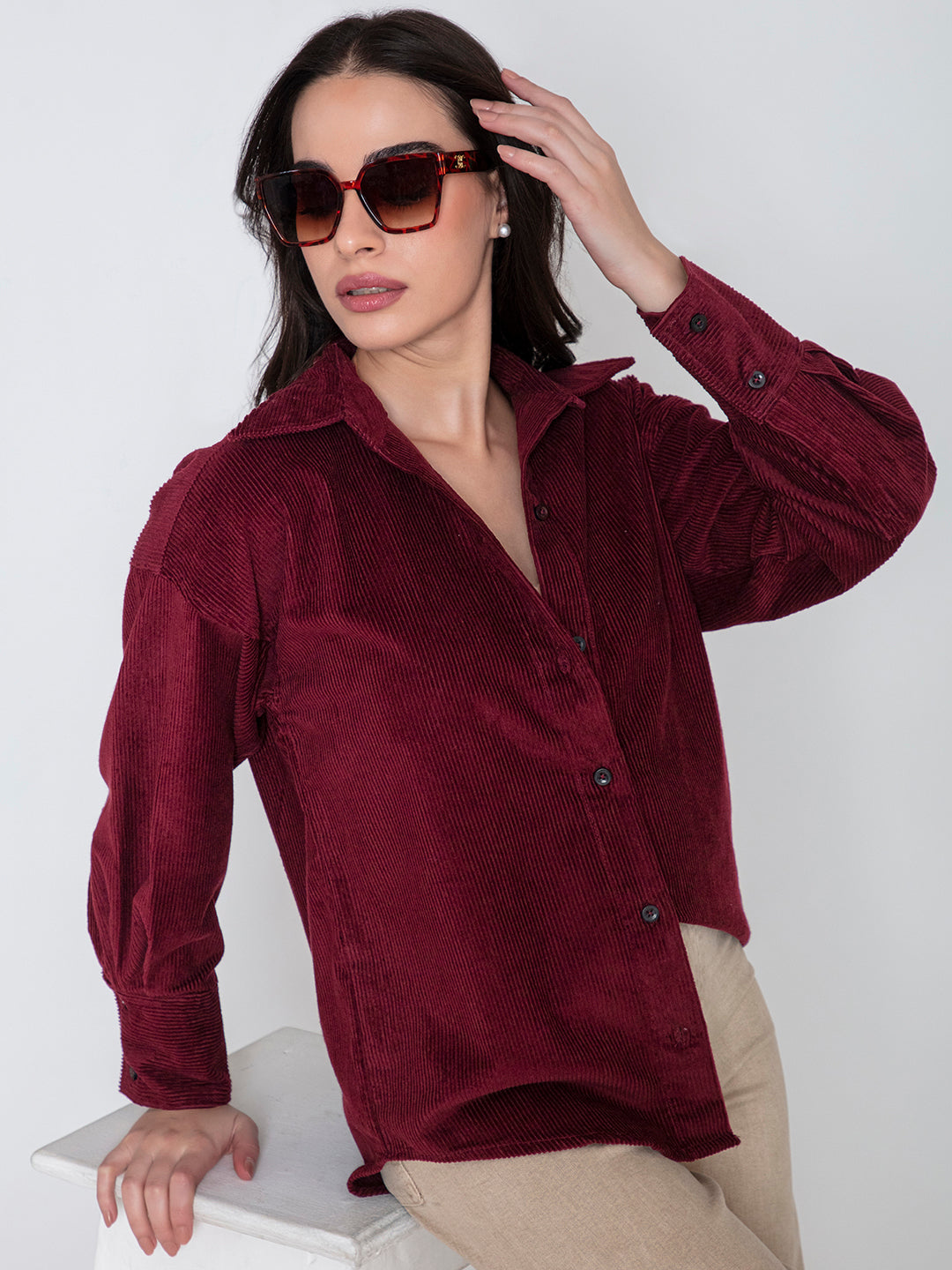 Front view of maroon oversized corduroy shirt for women