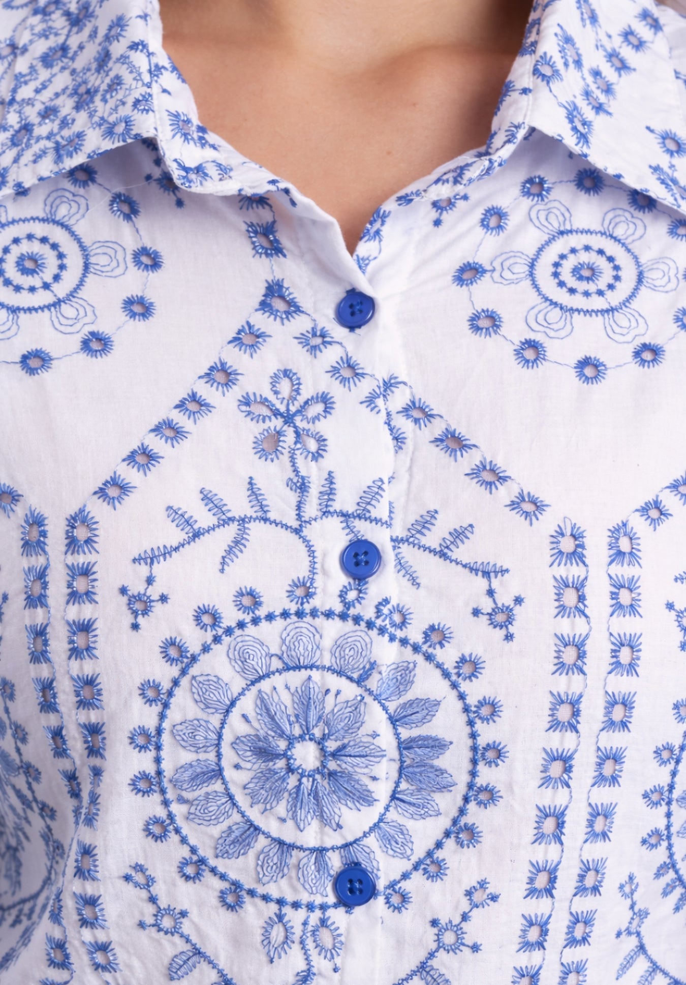 Cuff and embroidery detail on cotton shirt