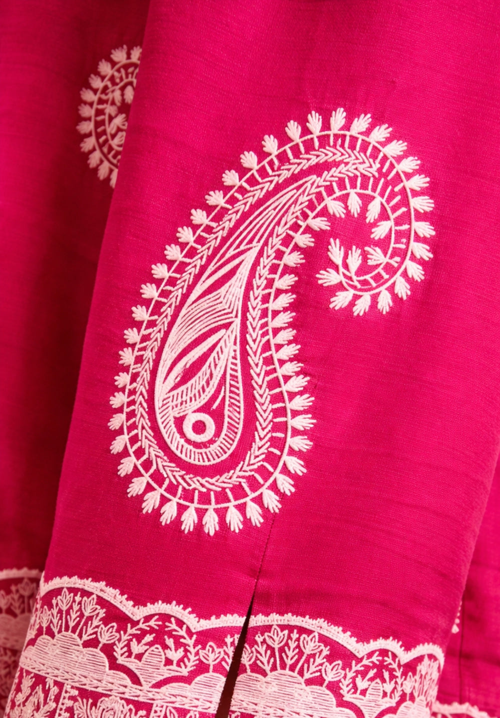 Curved hem detail of pink oversized puff print shirt