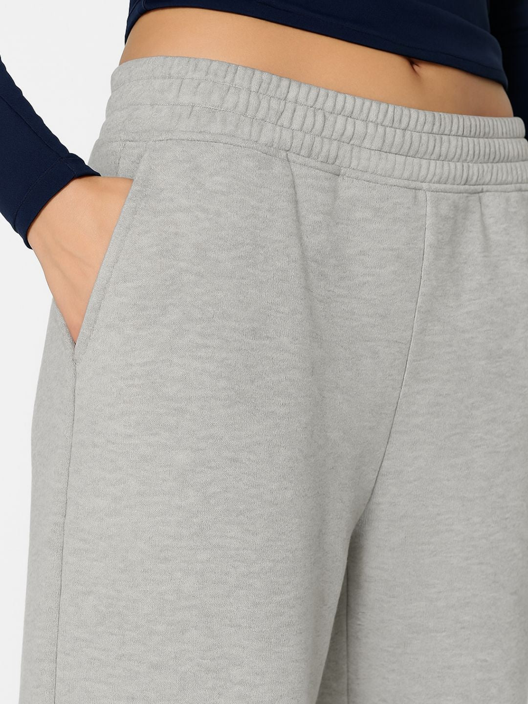 Lifestyle shot of grey track pants