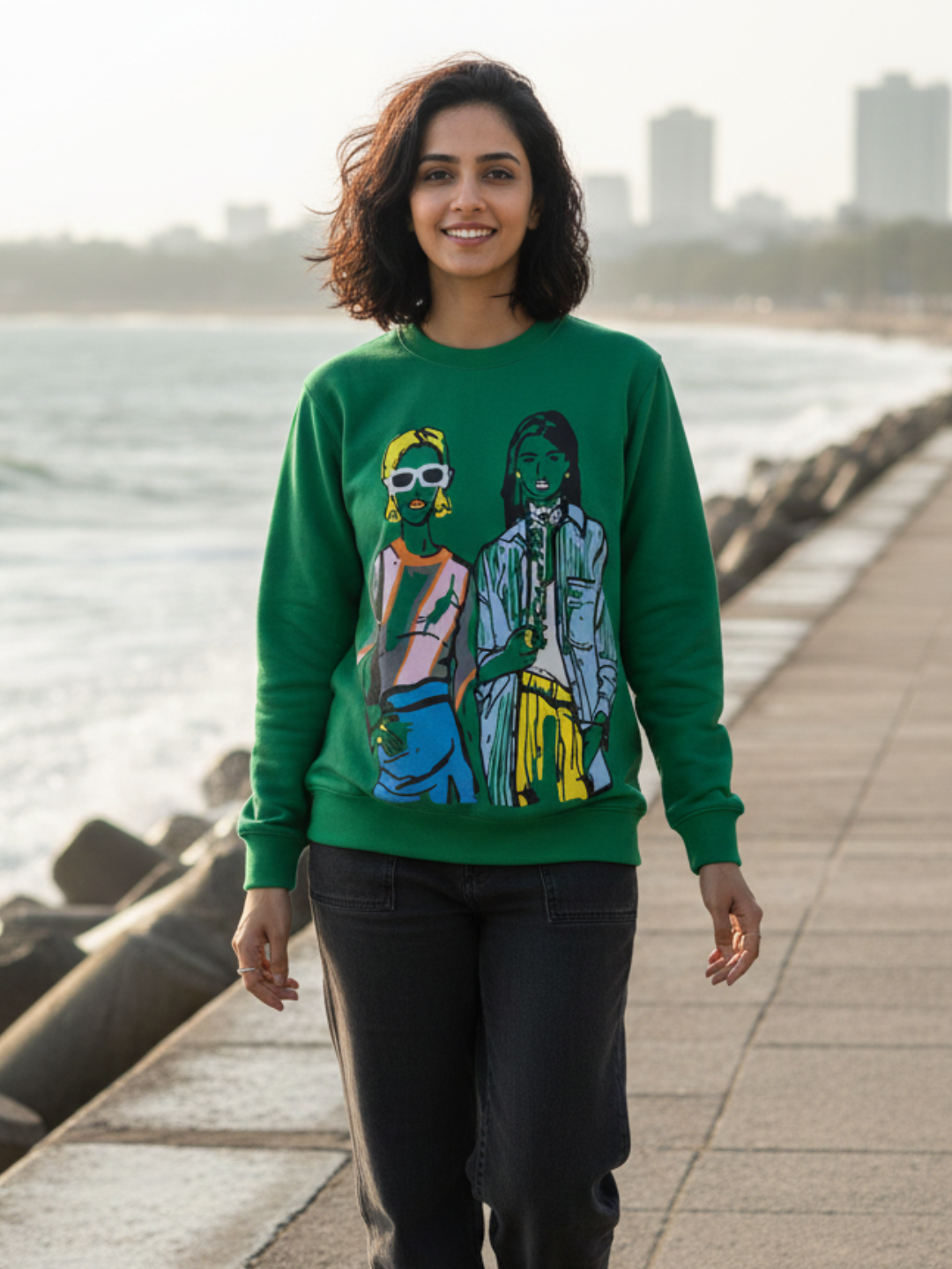 Front view of green illustrated print sweatshirt for women