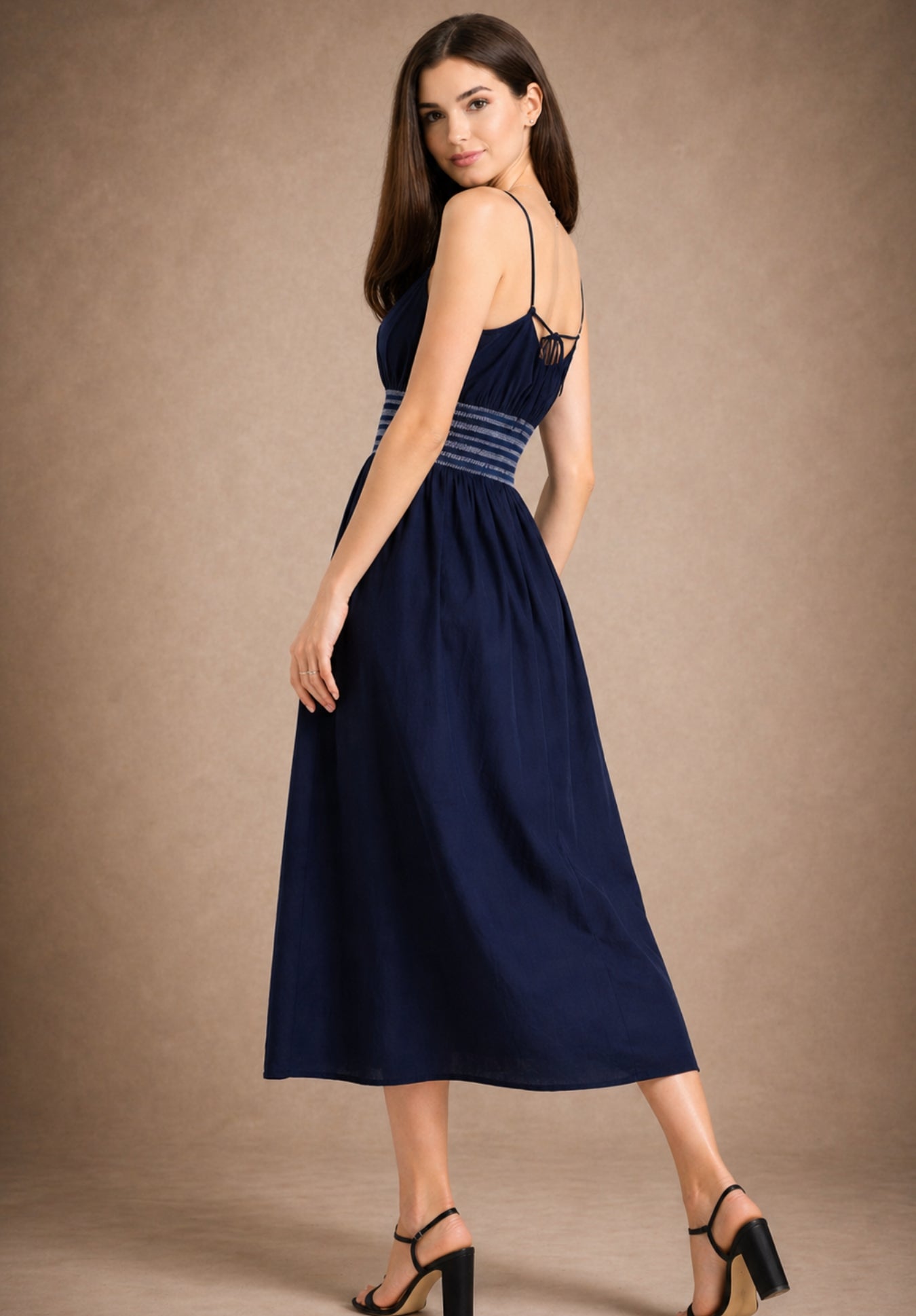 Full-length view of navy cotton A-line dress on model