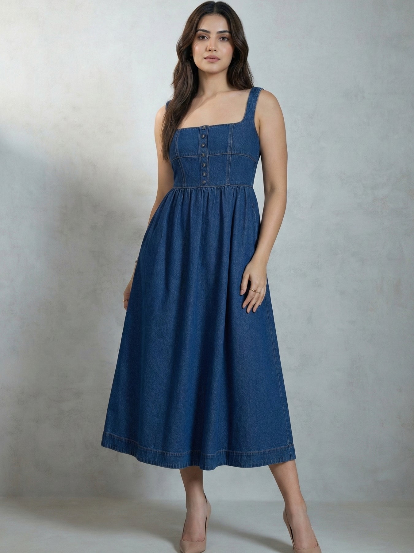Lifestyle shot of blue denim flared midi dress