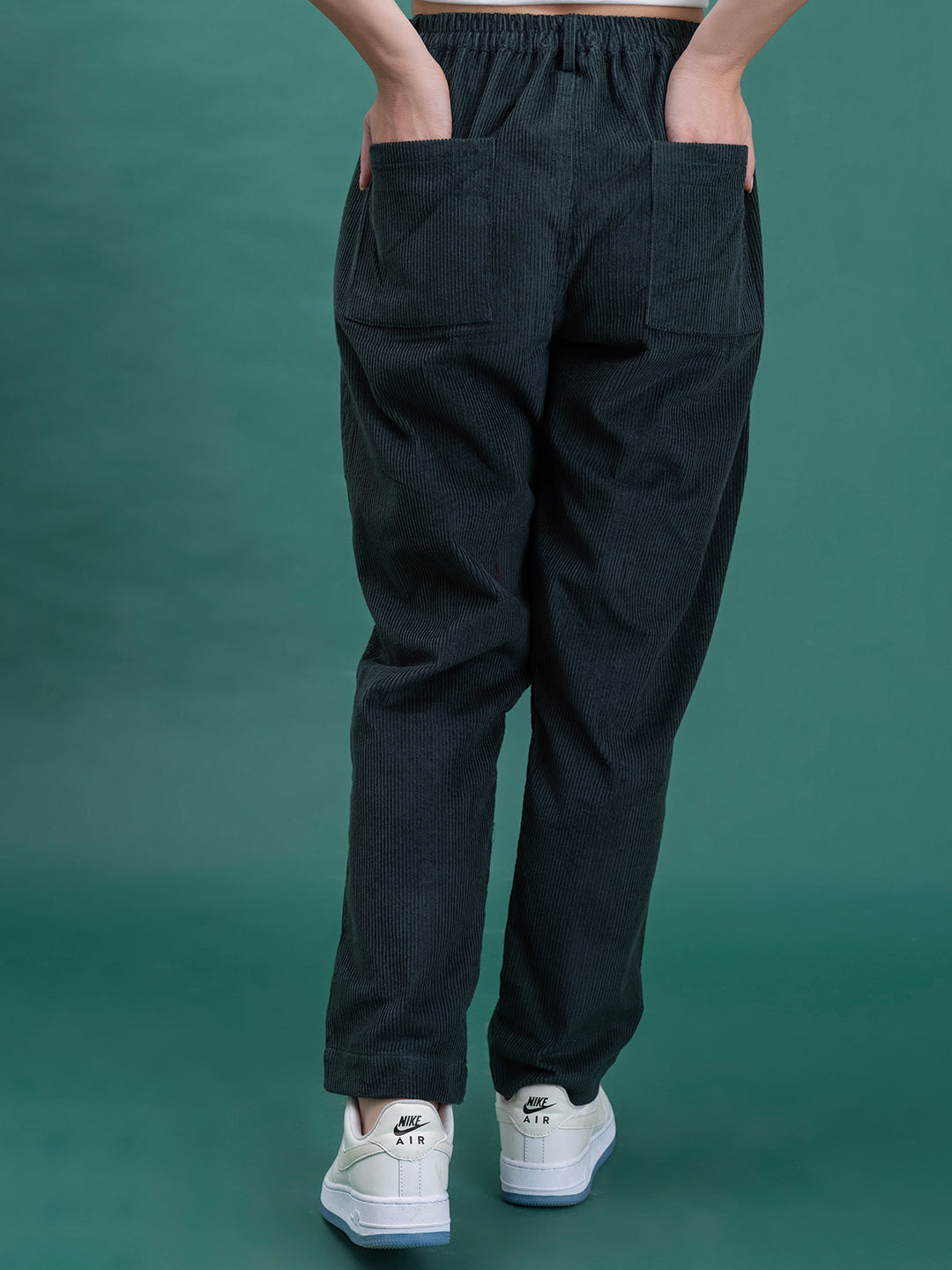 Back view of green corduroy baggy trousers