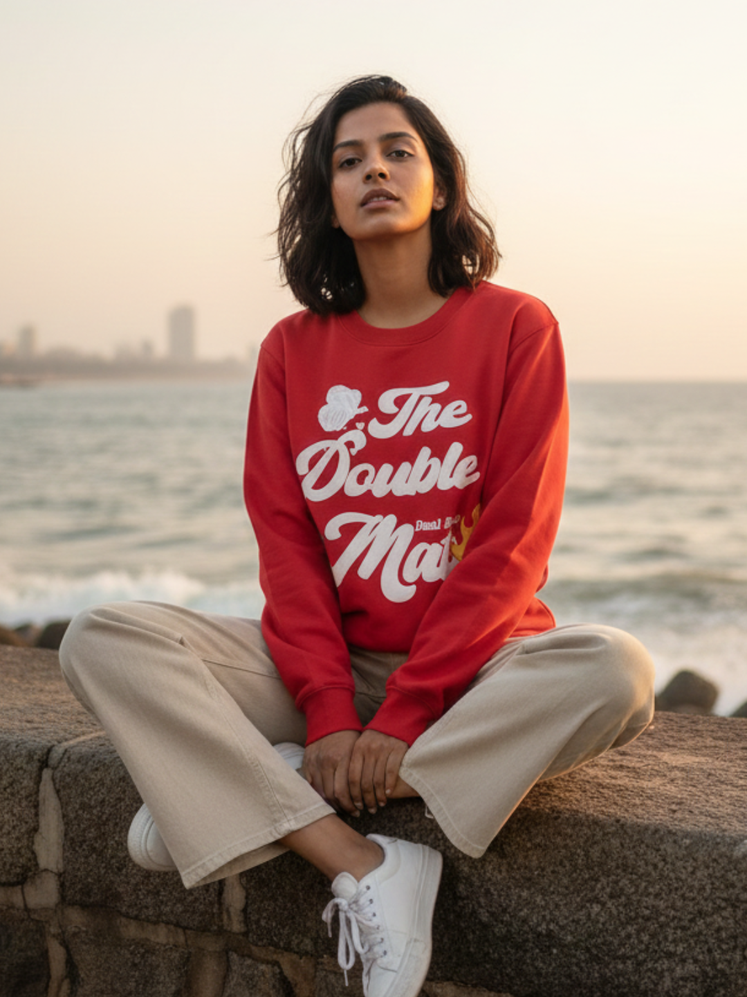 Front view of red graphic print sweatshirt for women