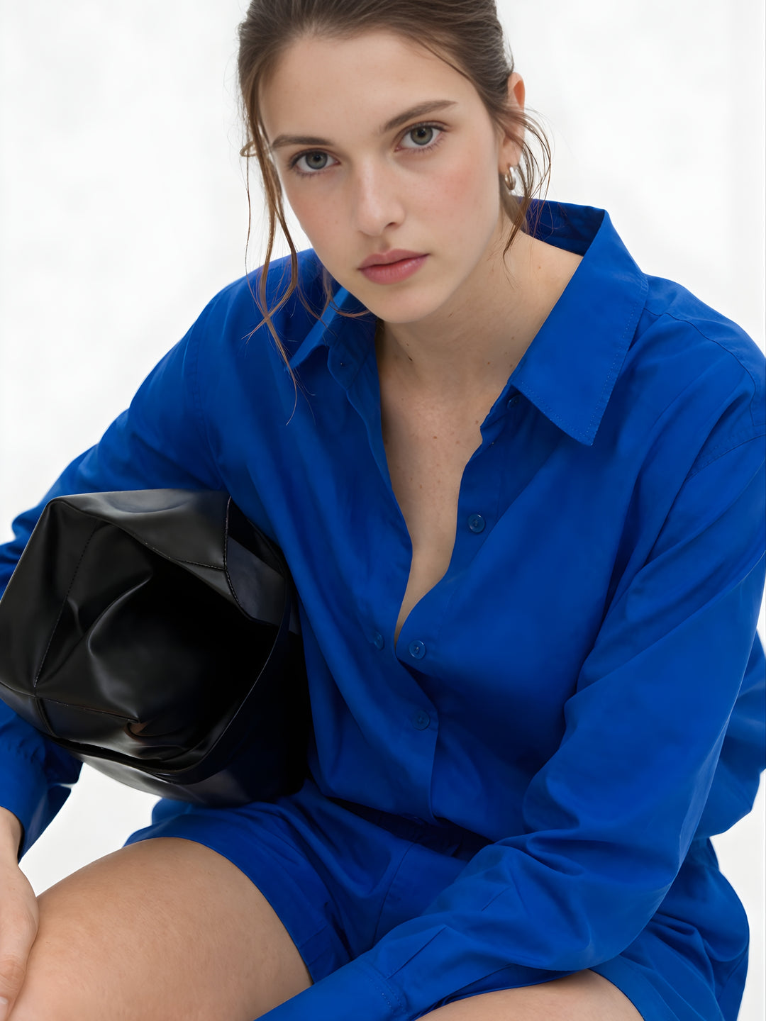 Front view of woman in royal blue poplin cotton shorts co-ord set