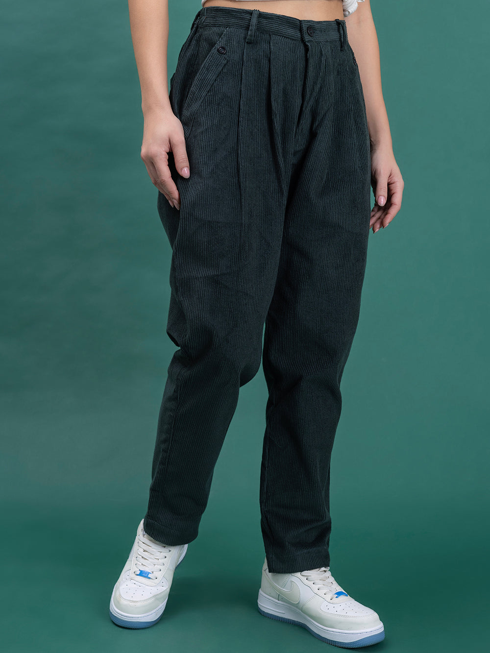 Side view of green corduroy relaxed-fit trousers