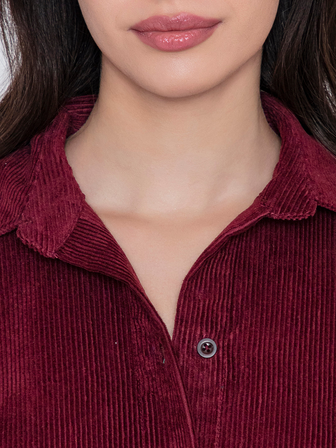 Close-up of plush corduroy texture in maroon