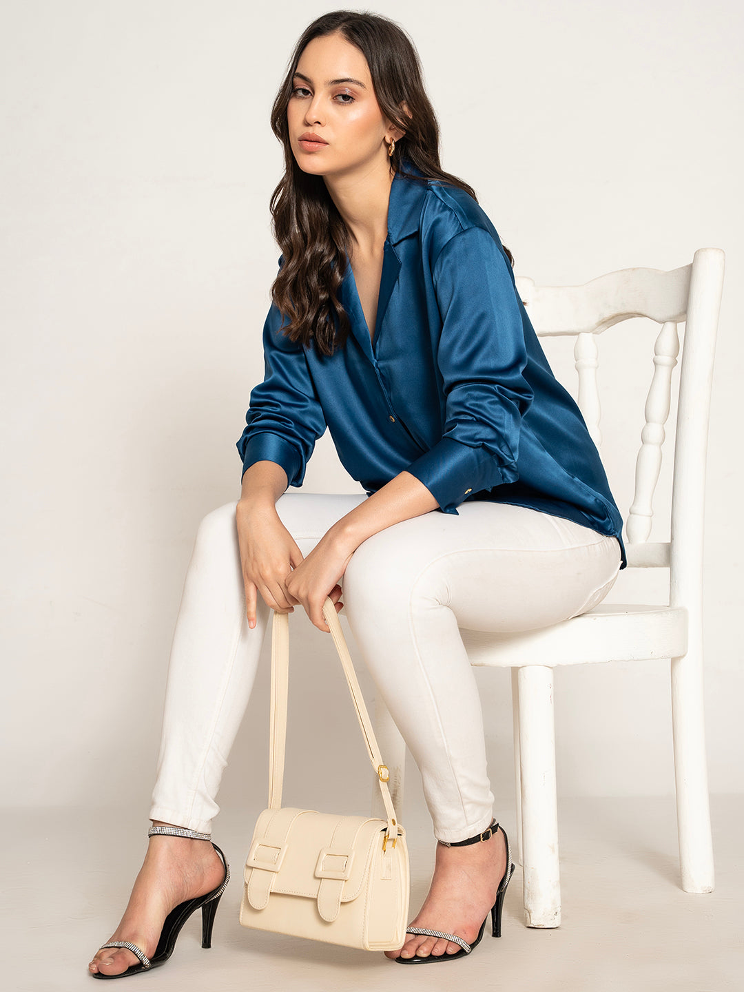 Side view of navy satin shirt with relaxed fit