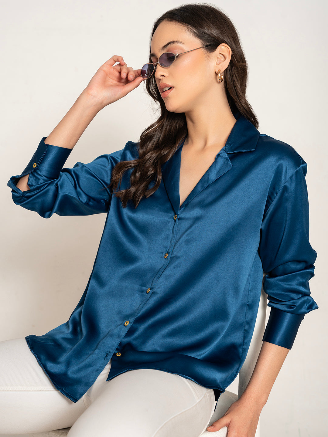 Close-up of navy blue satin fabric and Cuban collar