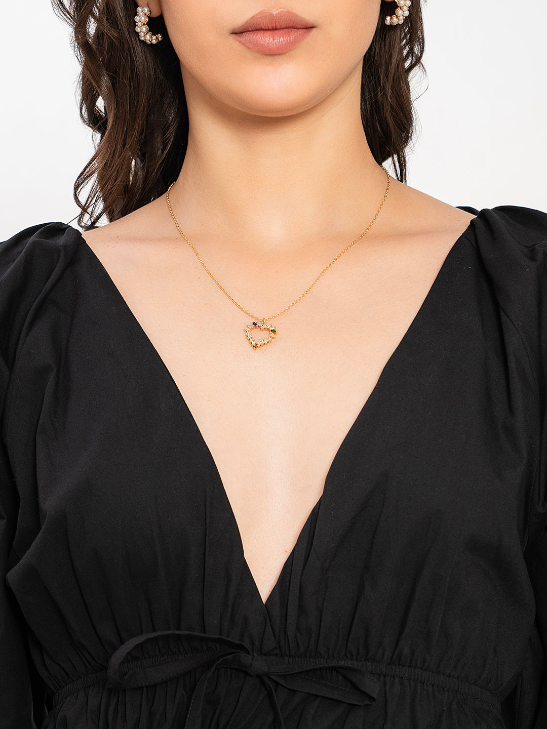 Close-up of V-neckline on black poplin cotton top