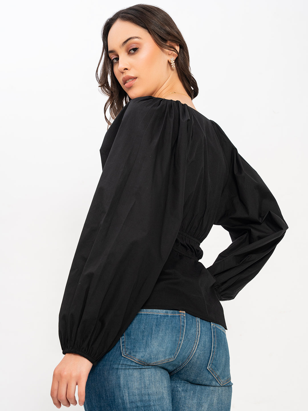 Lifestyle shot of woman wearing black V-neck top