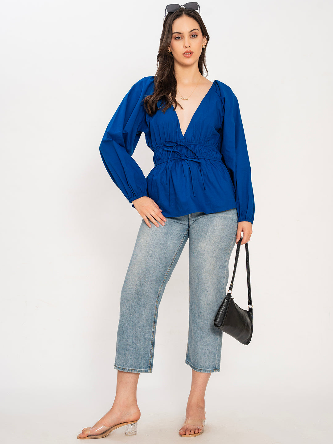 Folded blue poplin cotton V-neck top detail