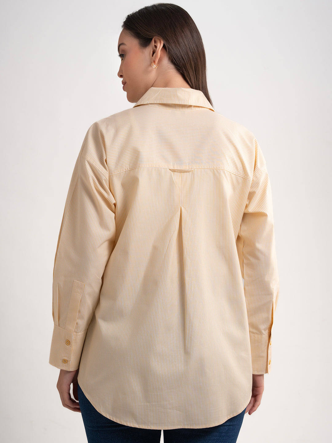 Full-length view of yellow striped cotton shirt