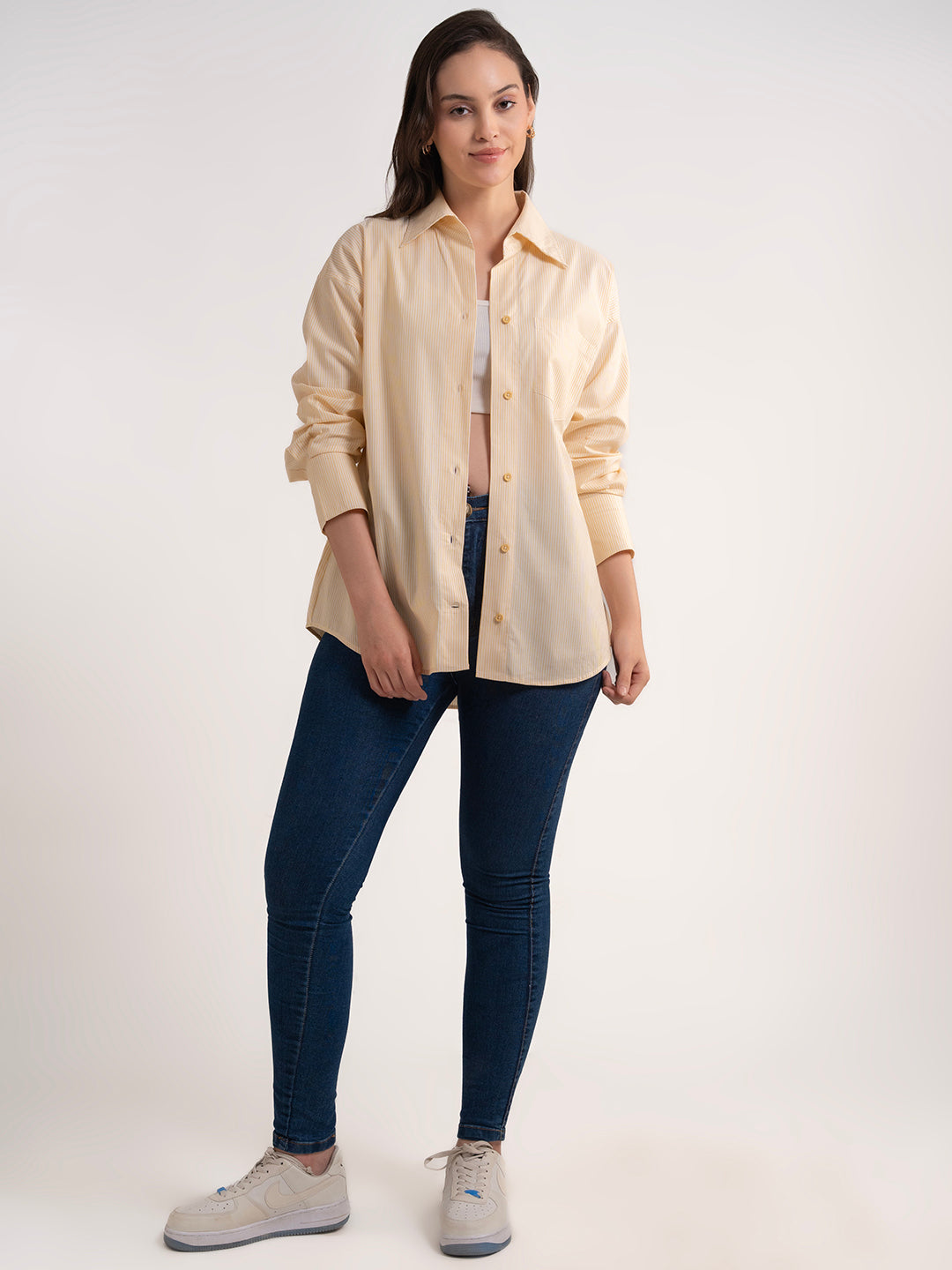 Detail of cuff on yellow cotton shirt