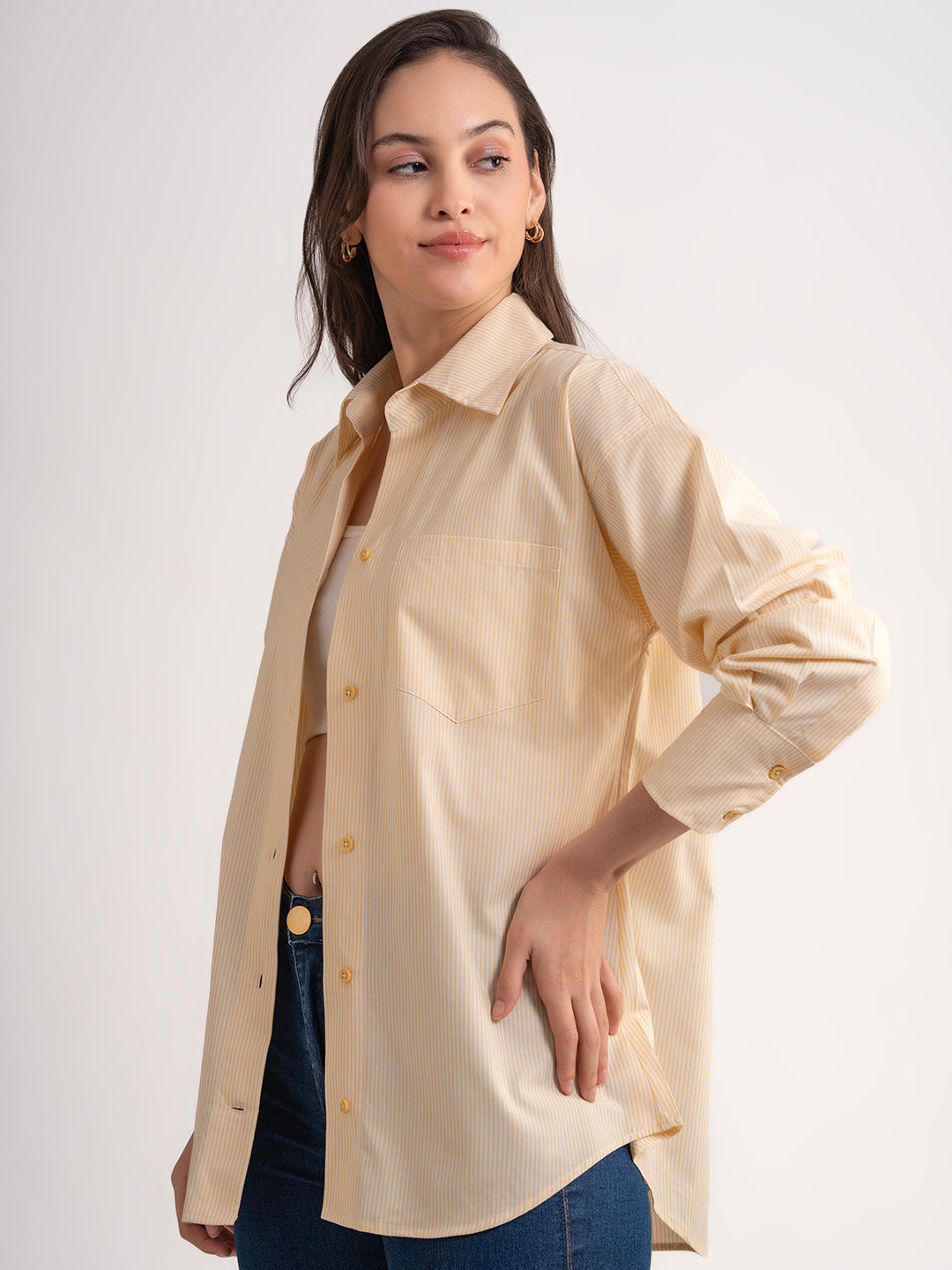 Detail of buttons on yellow striped shirt