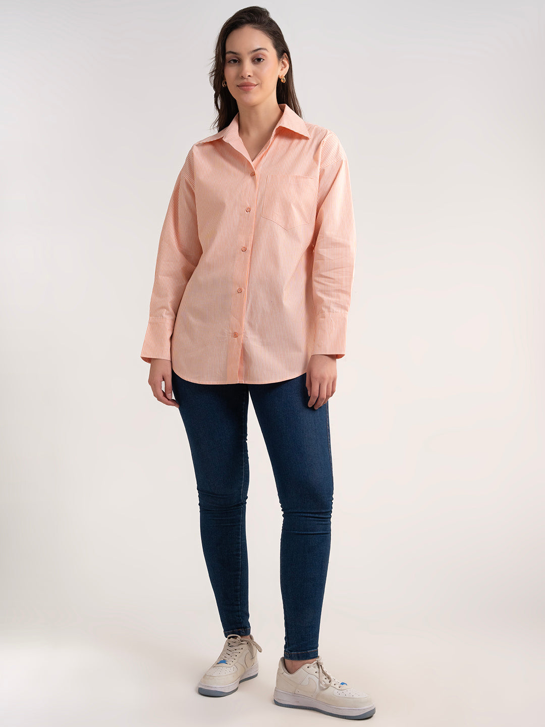 Detail of cuff on orange cotton shirt