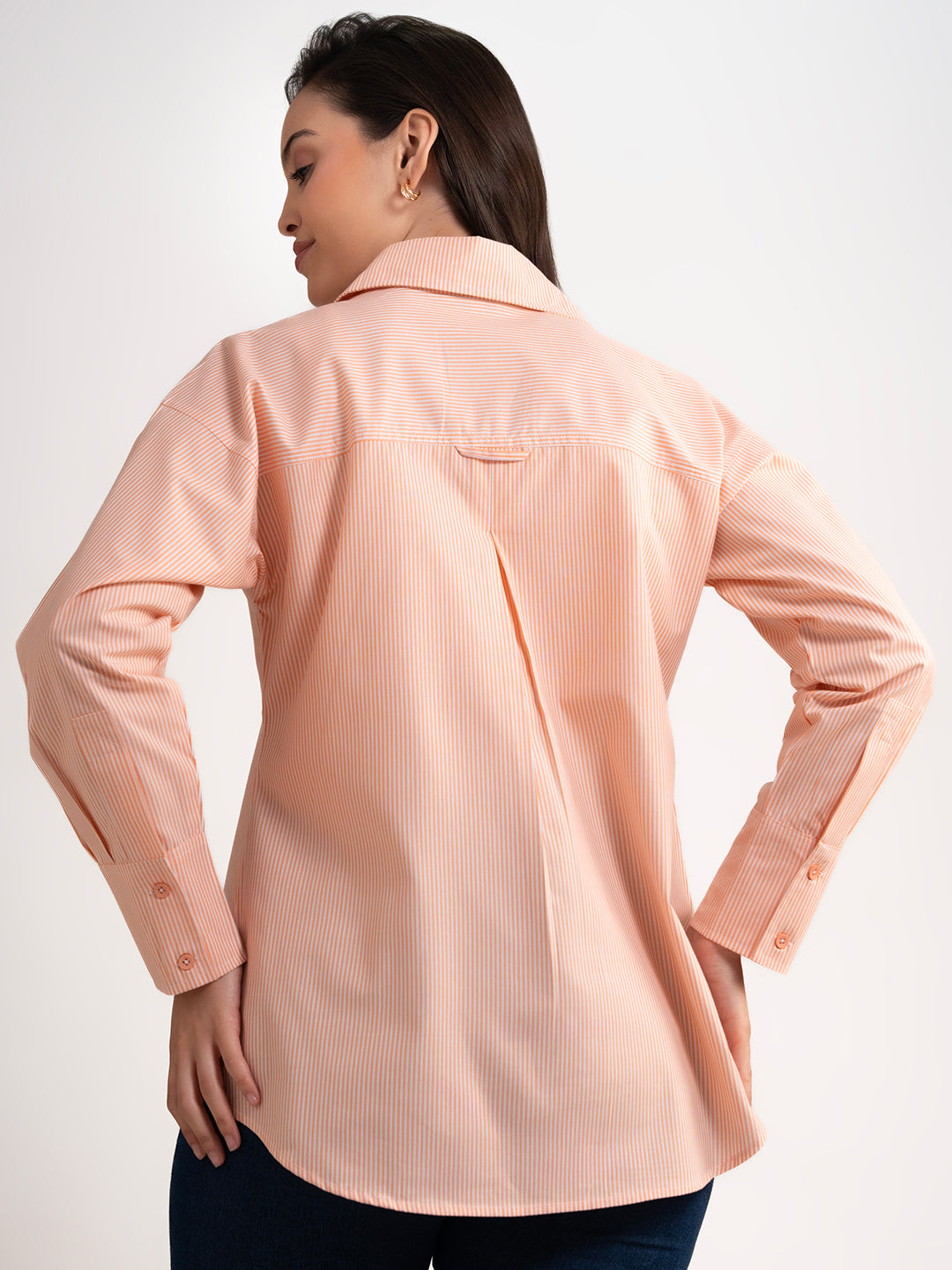 Full-length view of orange striped cotton shirt