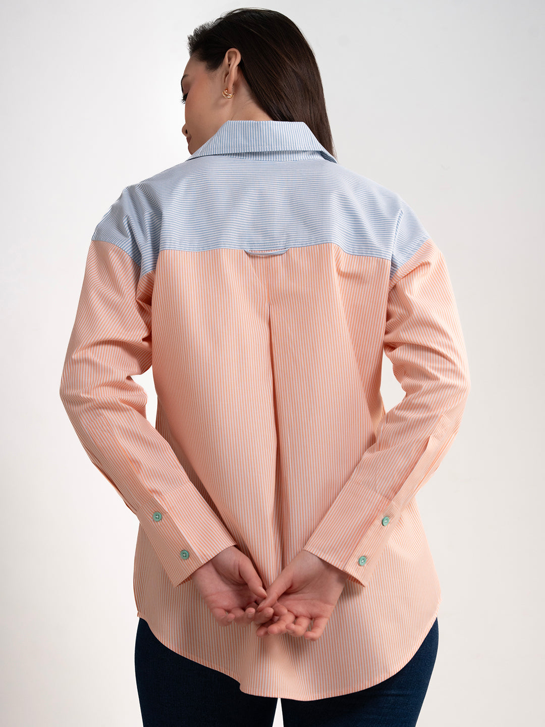 Full-length view of colorblocked striped cotton shirt