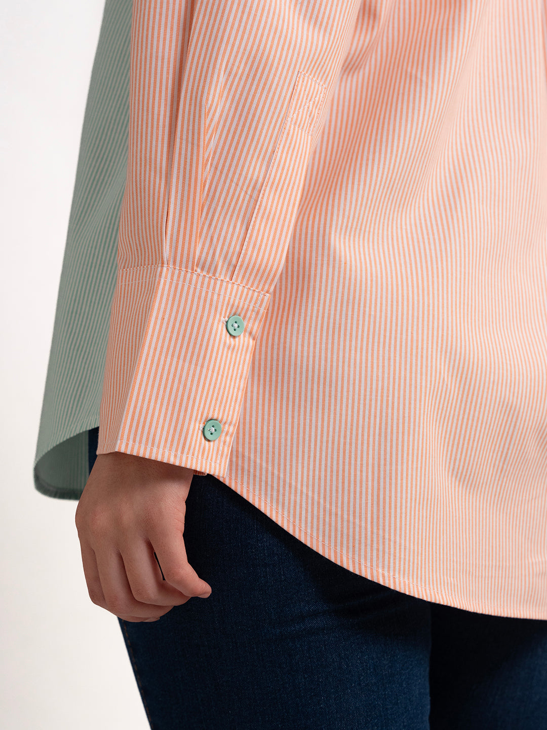 Styled side view of colorblocked striped shirt
