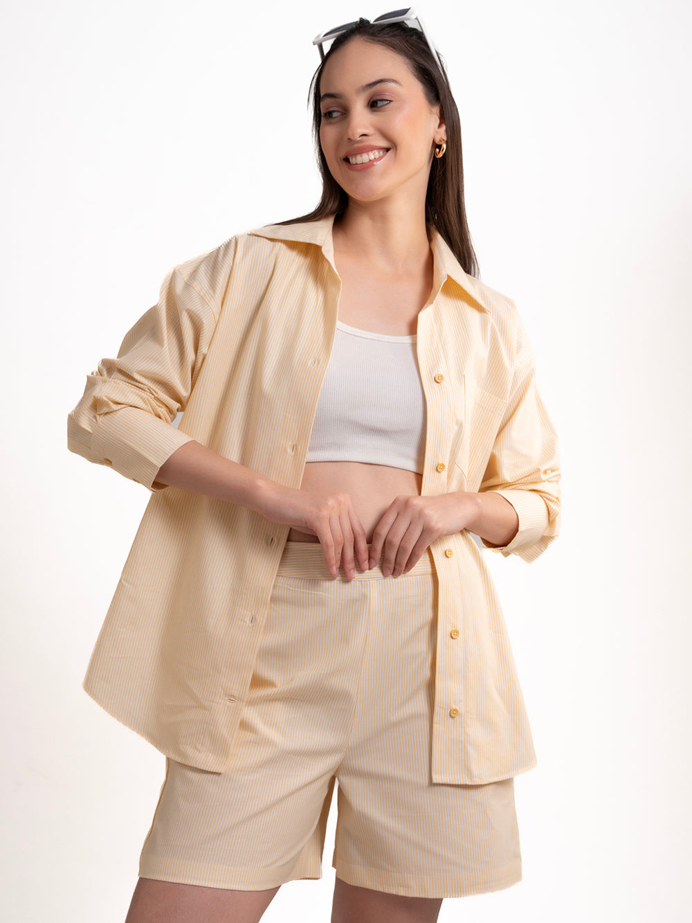 Lifestyle shot of woman wearing yellow striped cotton co-ord