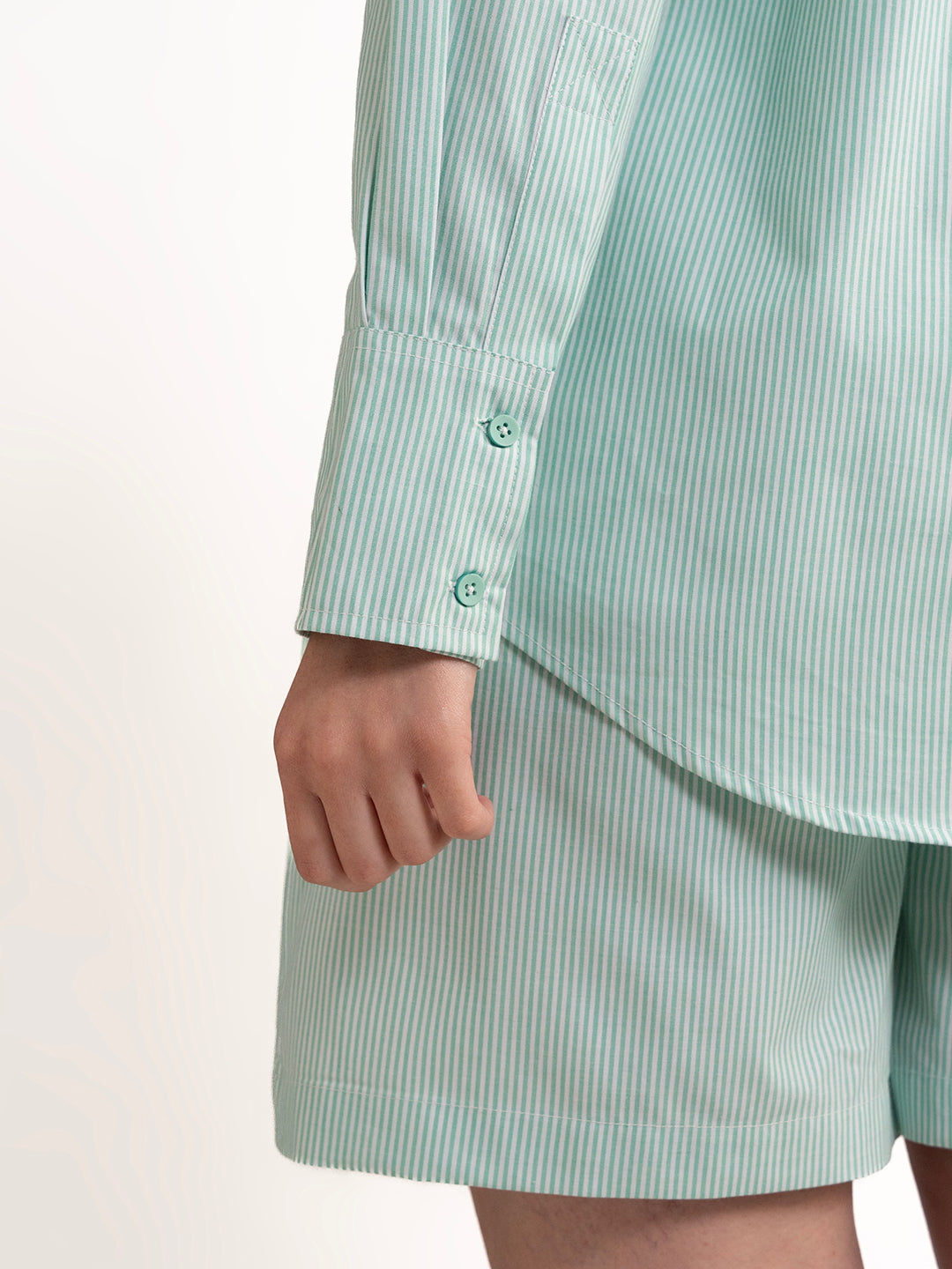 Styled view of green cotton co-ord with sandals