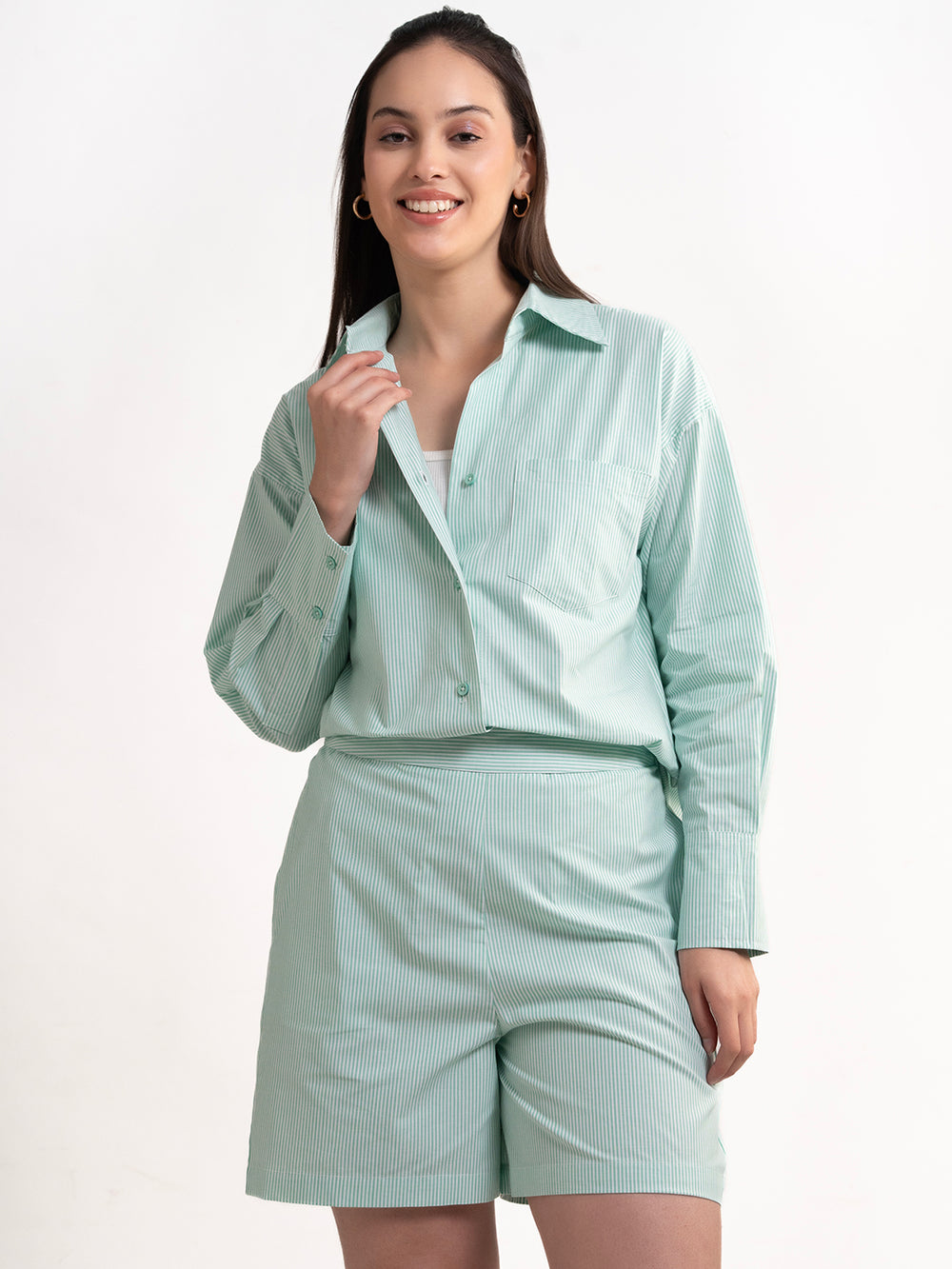 Lifestyle shot of woman wearing green striped cotton co-ord