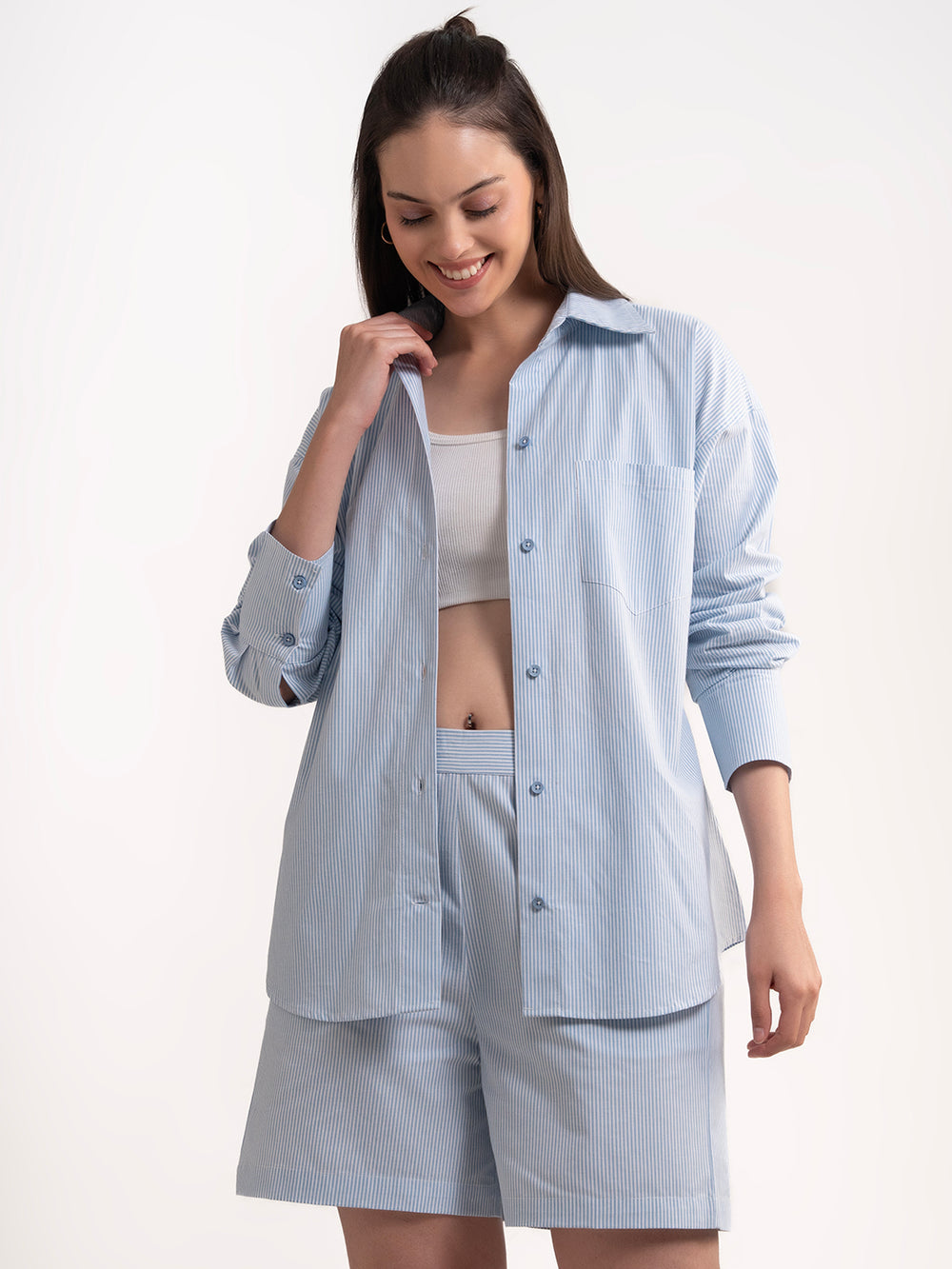 Lifestyle shot of woman wearing blue striped cotton co-ord