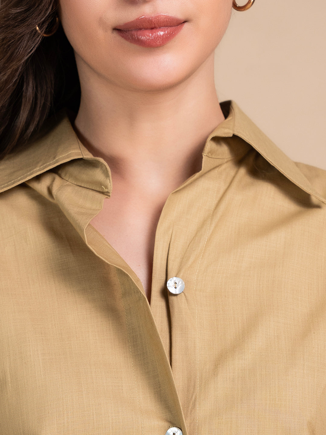 Styled view of beige linen shirt with trousers