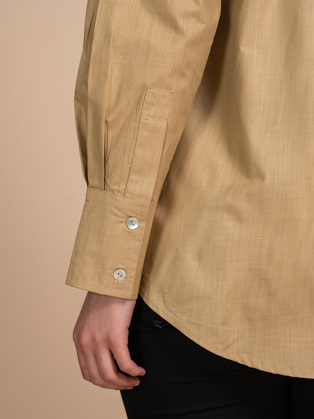 Detail of cuff on beige linen shirt