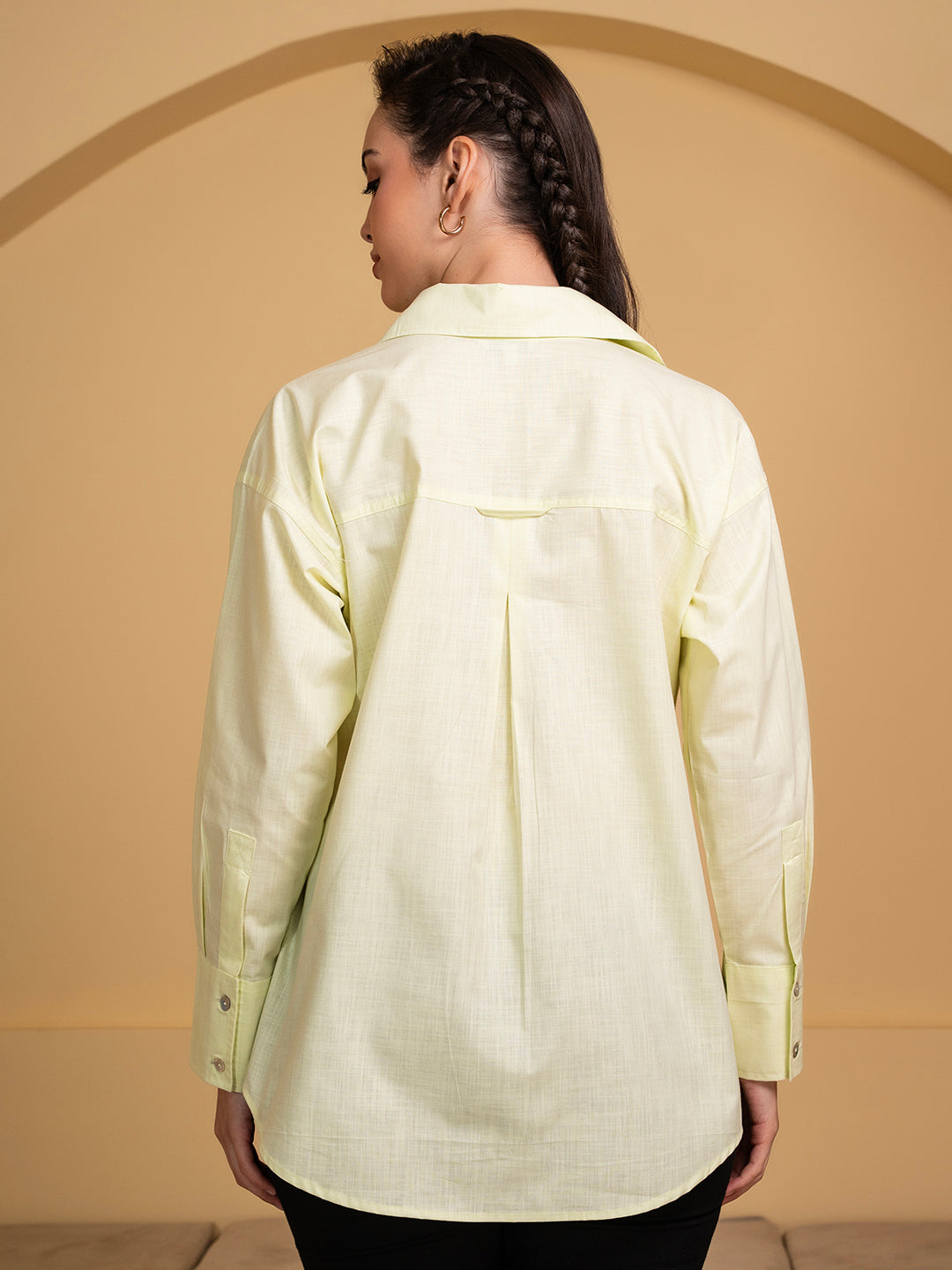 Detail of cuff on green linen shirt