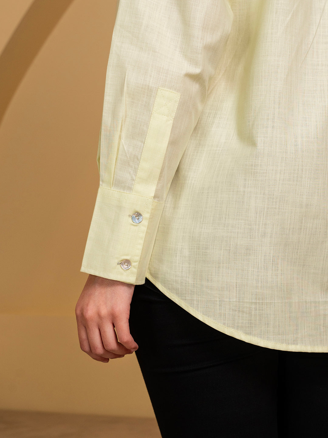 Styled view of green linen shirt with trousers