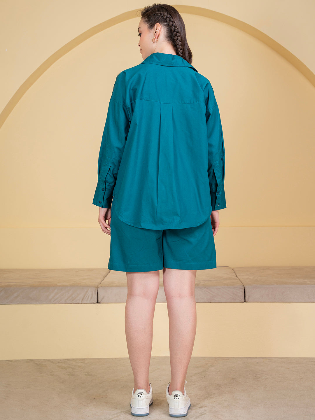 Lifestyle shot of woman wearing turquoise poplin co-ord