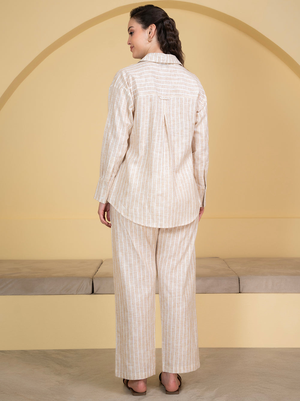 Lifestyle shot of woman wearing white beige linen co-ord