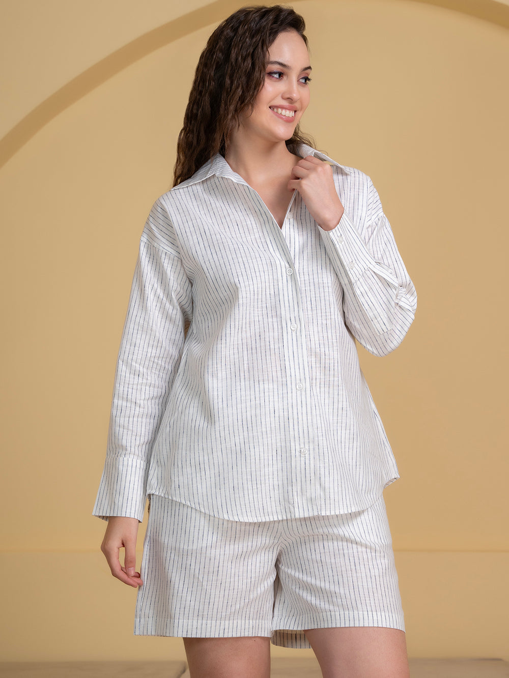 Lifestyle shot of woman wearing white blue linen co-ord