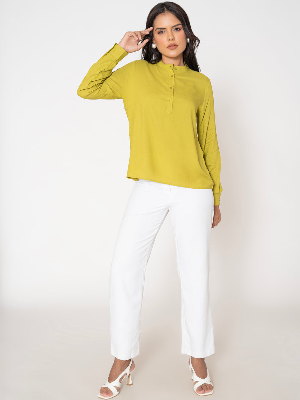 Side view of lime green rayon top showing fluid drape