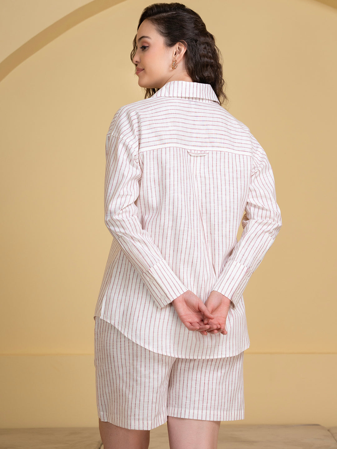 Side view of white pink linen co-ord shirt and shorts