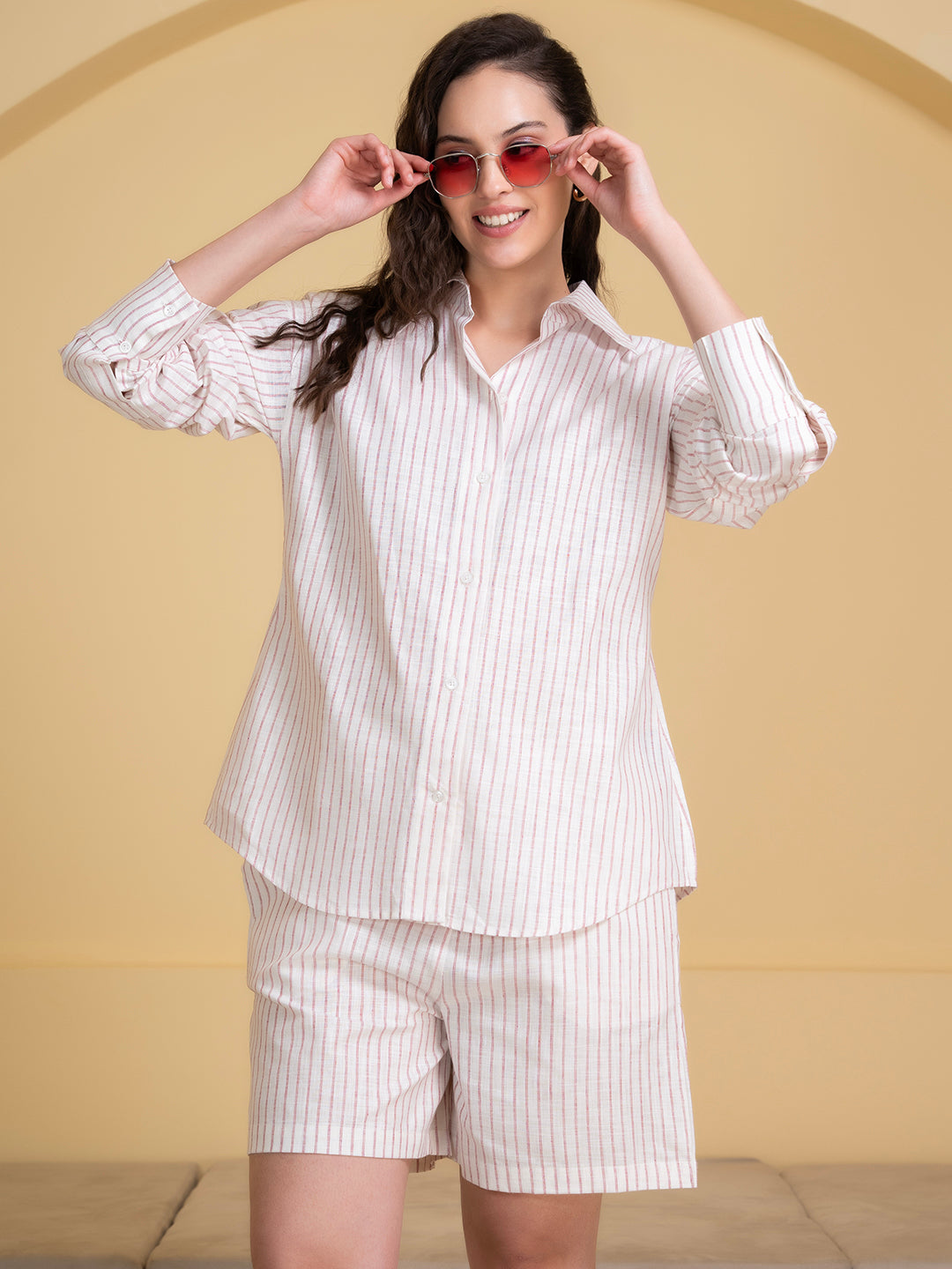 Detail of buttons on white pink linen co-ord shirt