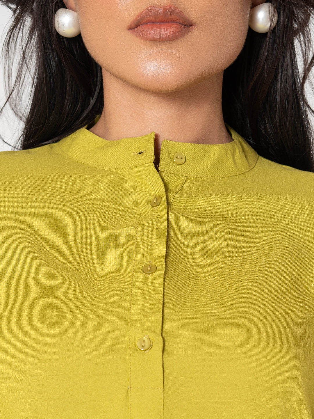 Close-up of neckline on lime green rayon top