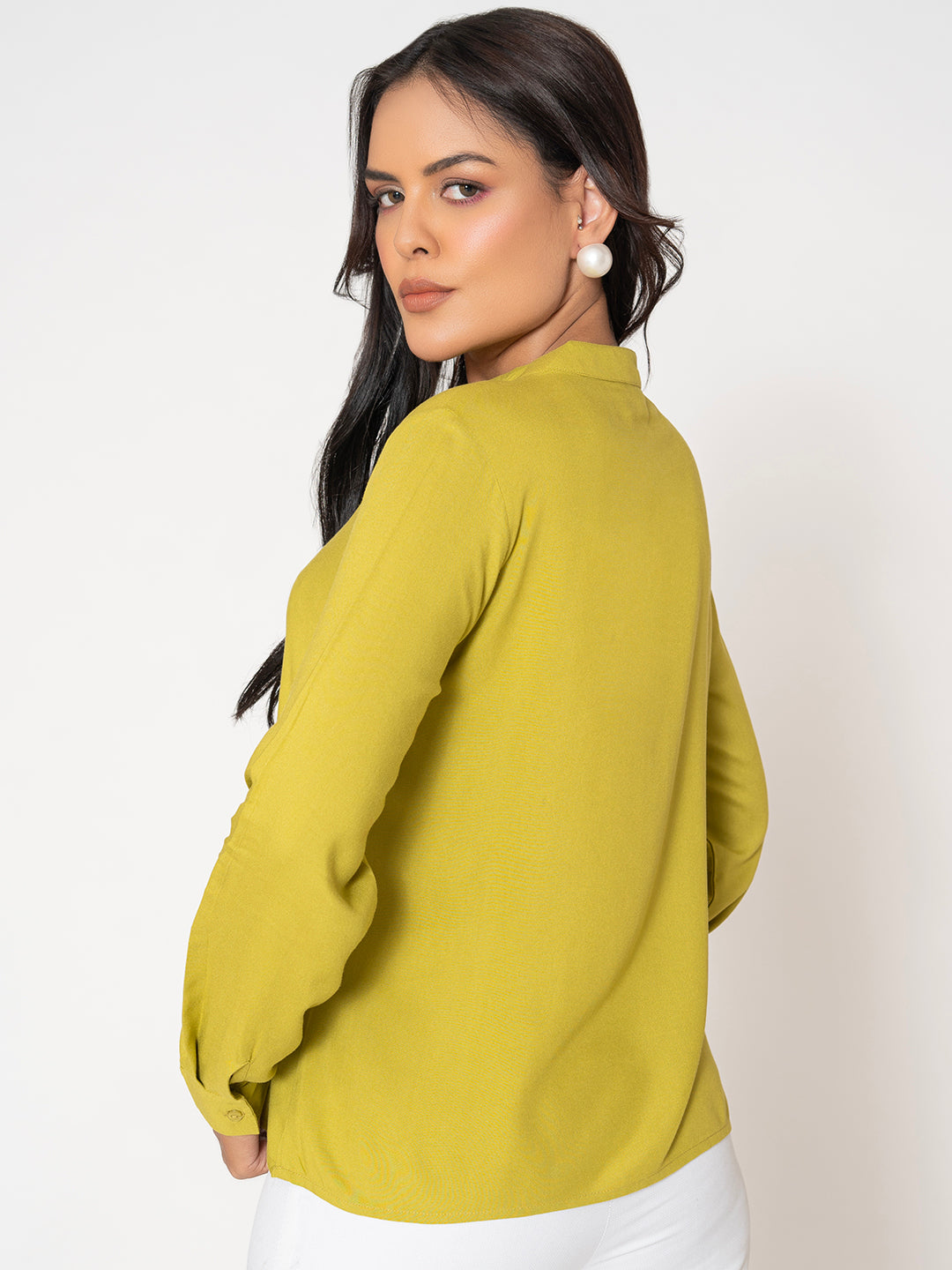 Lifestyle shot of model in lime green rayon top