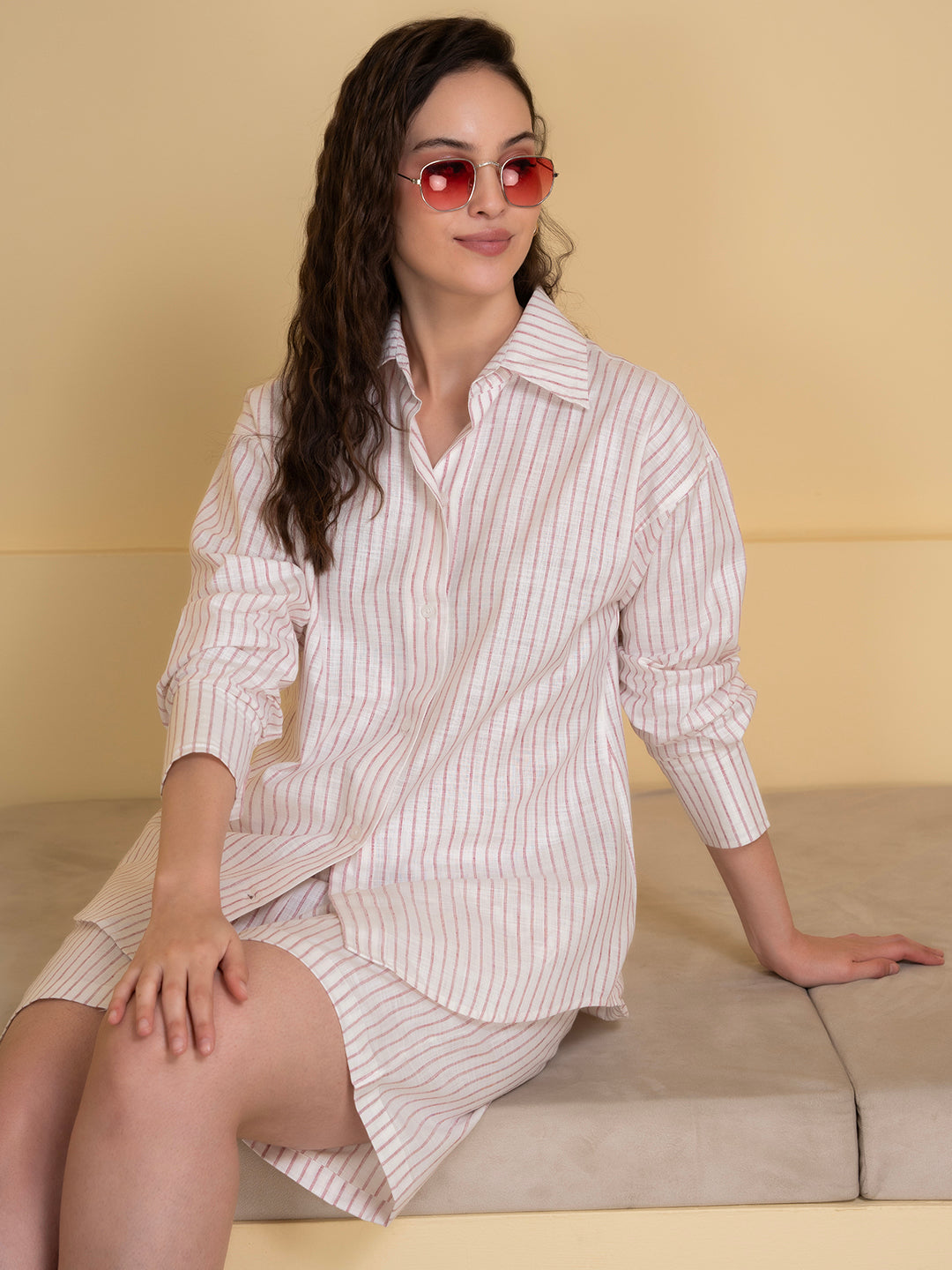 Styled view of white pink linen co-ord with sandals