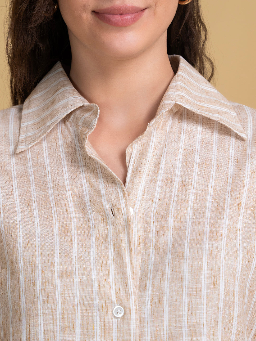 Detail of cuff on white beige linen striped shirt