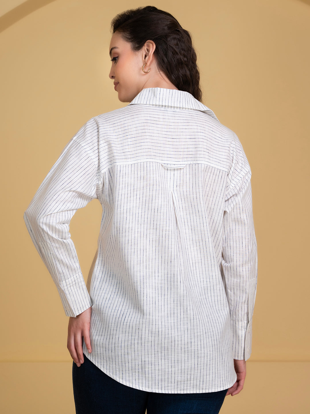 Styled view of white blue linen shirt with trousers